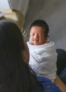 smiling newborn baby girl