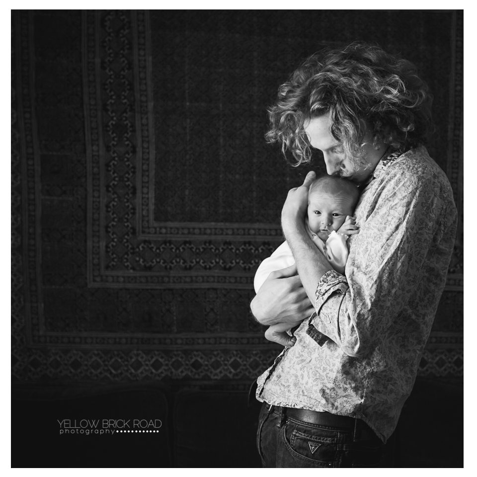 dad and newborn daughter back and white portrait