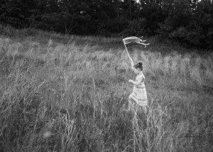 black and white of girl in field during kitchener family portraits