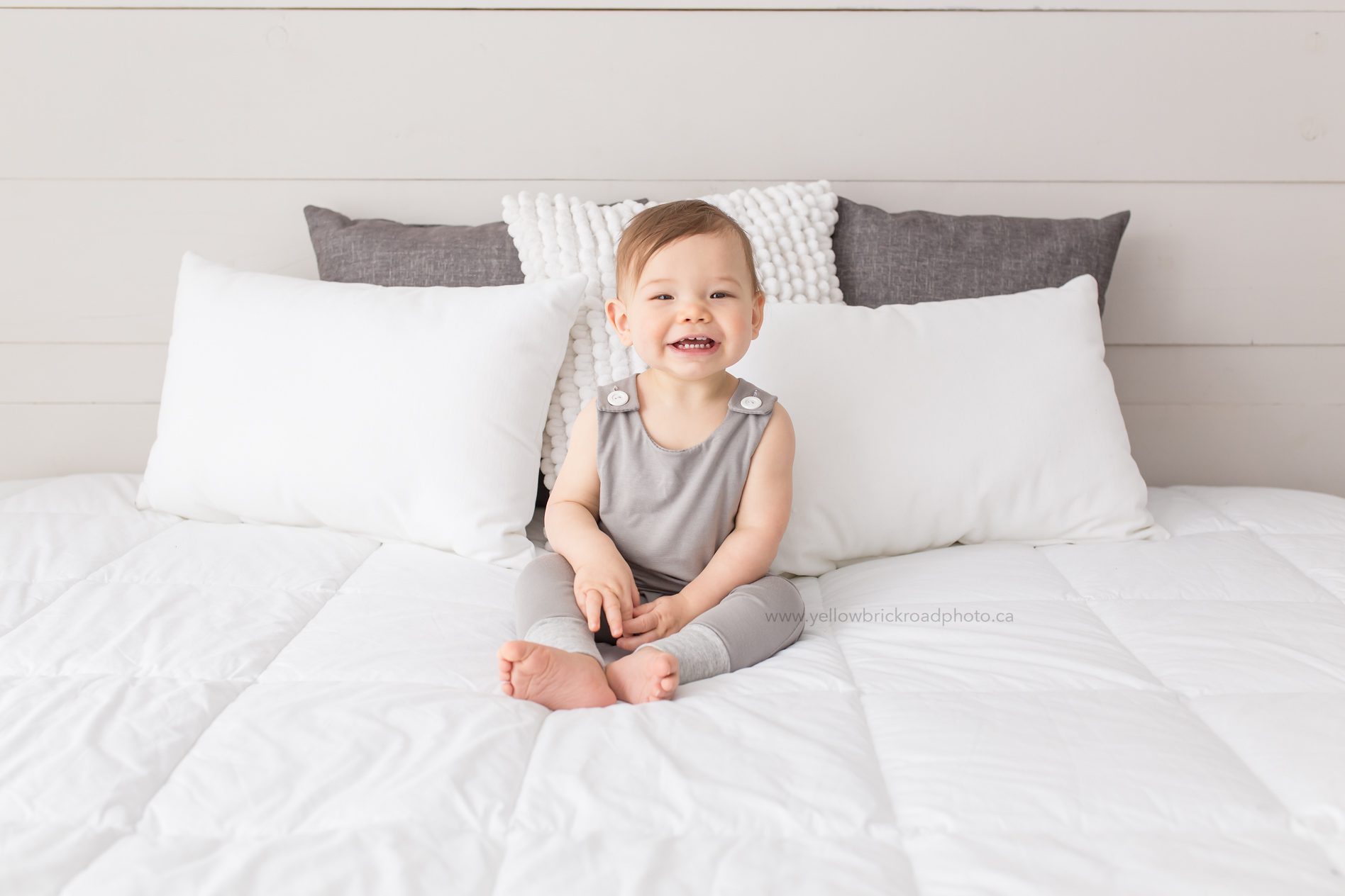 smiling baby boy in romper Guelph baby photographer Yellow Brick road Photography