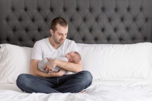 Newborn Lifestyle session new dad holding baby boy Newborn Lifestyle www.yellowbrickroadphoto.ca