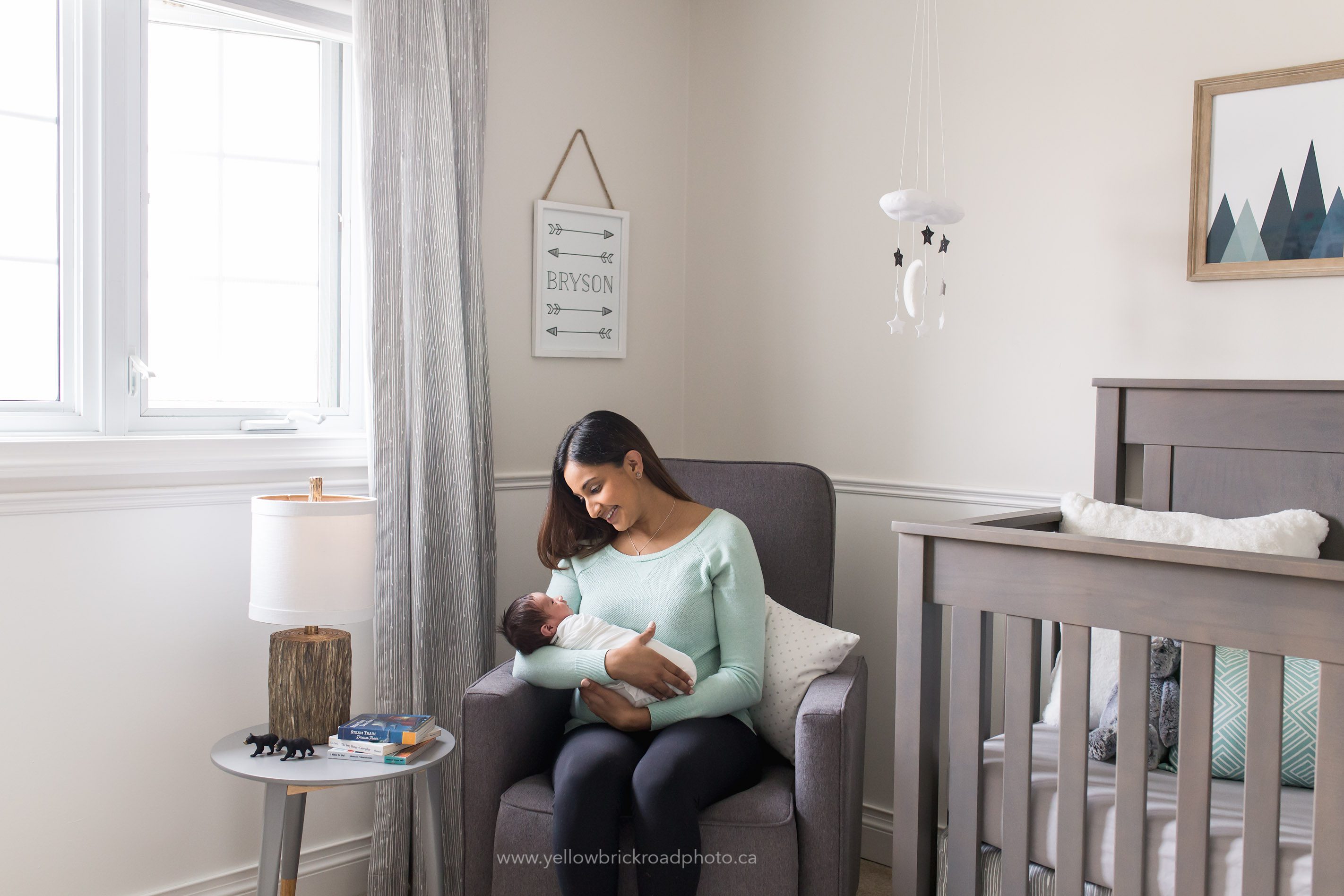 Waterloo Newborn Photographer mom and baby in nursery