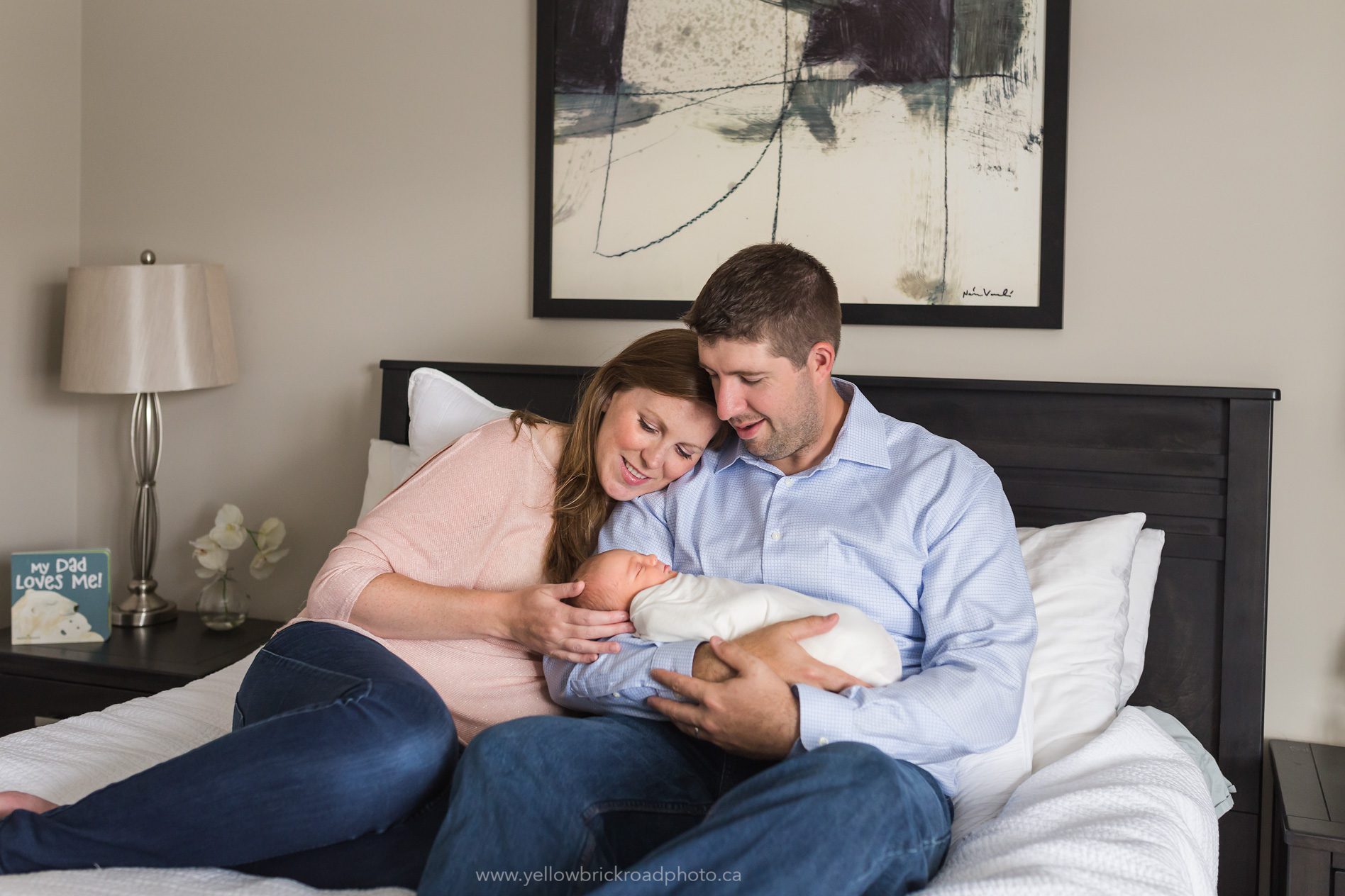 Newborn Photography Guelph new parents holding baby www.yellowbrickroadphoto.ca