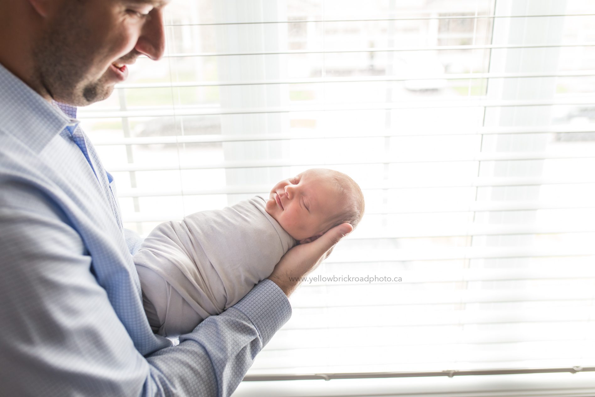 Newborn Photography Guelph Dad holding new baby www.yellowbrickroadphoto.ca