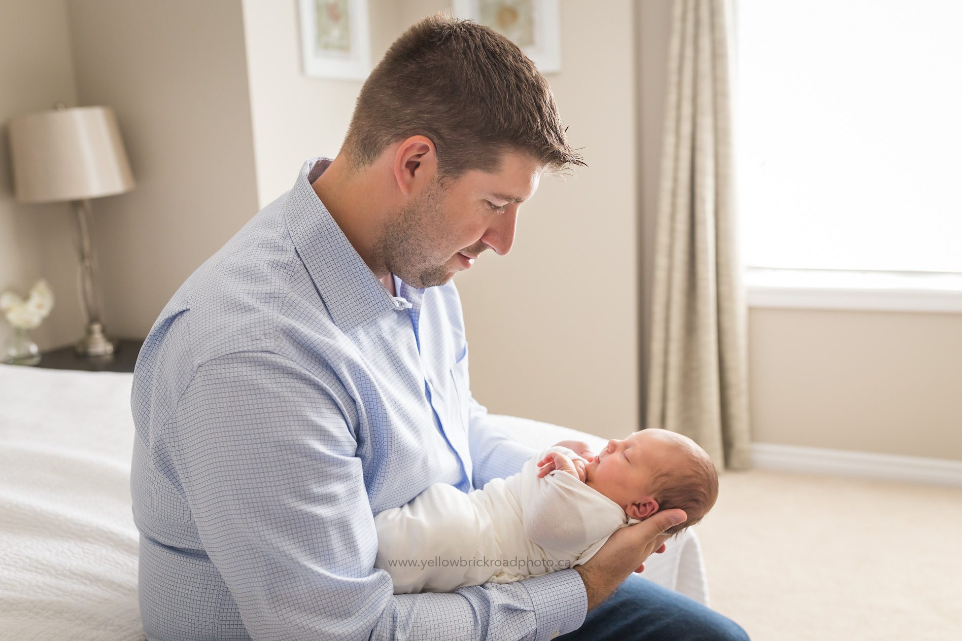 Newborn Photography Guelph Dad holding daughter www.yellowbrickroadphoto.ca