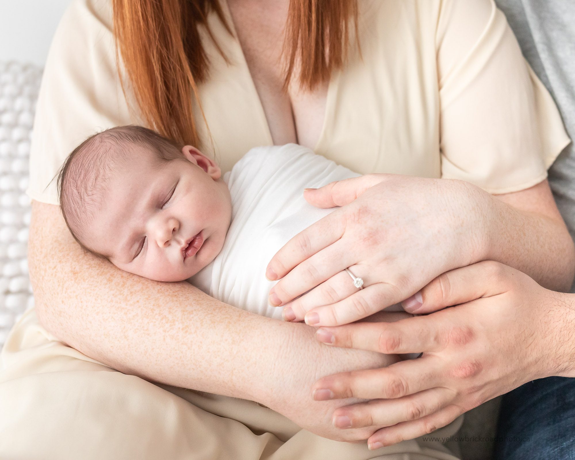 parents holding newborn