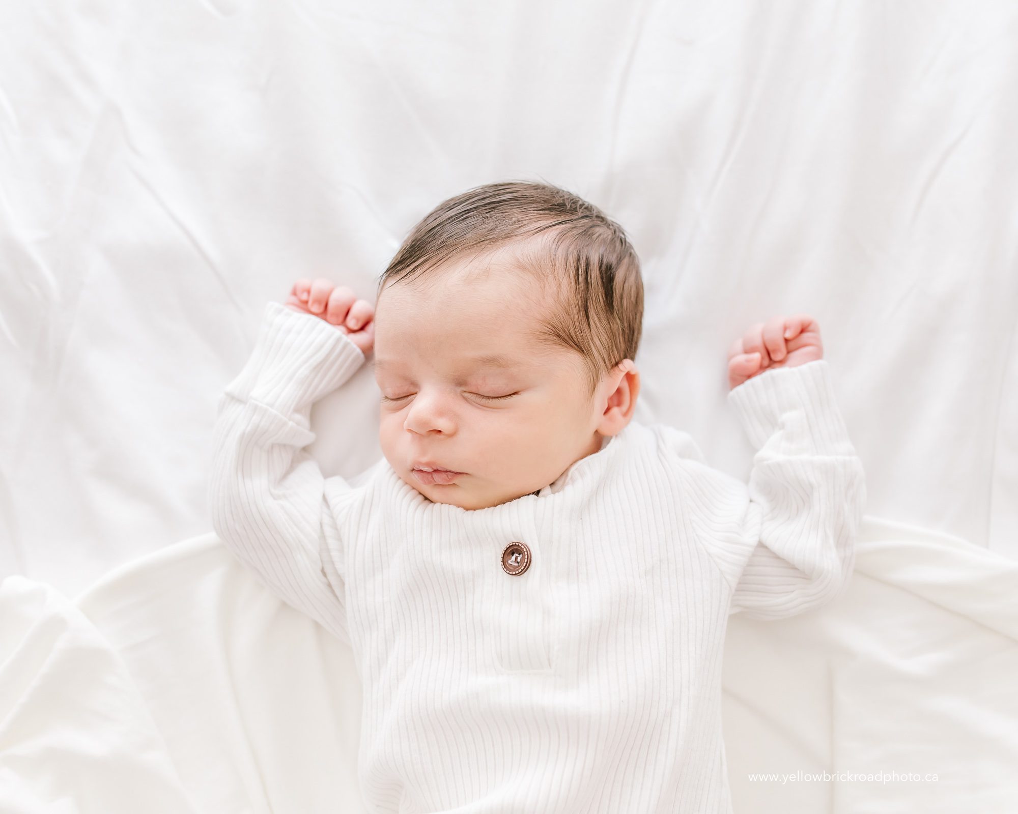 baby sleeping on bed