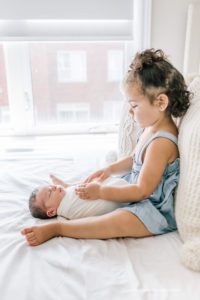 big sister with baby