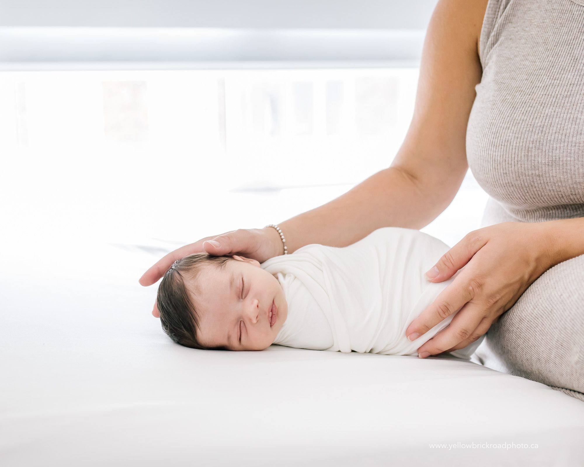 mom rubbing baby head