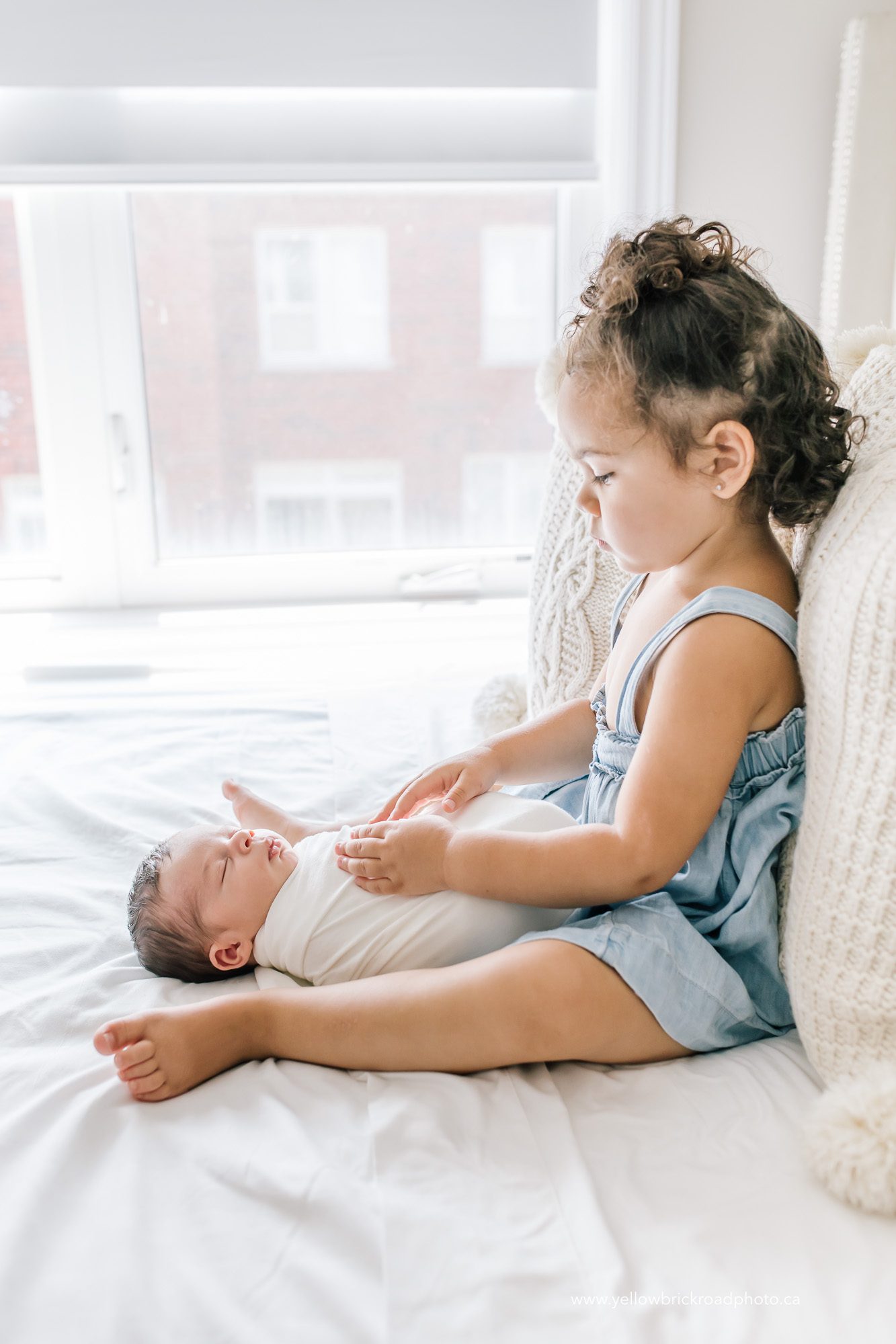 big sister with baby
