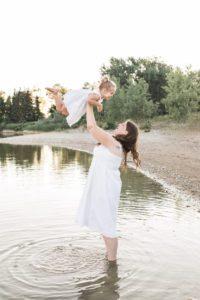 beach maternity session having fun in lake