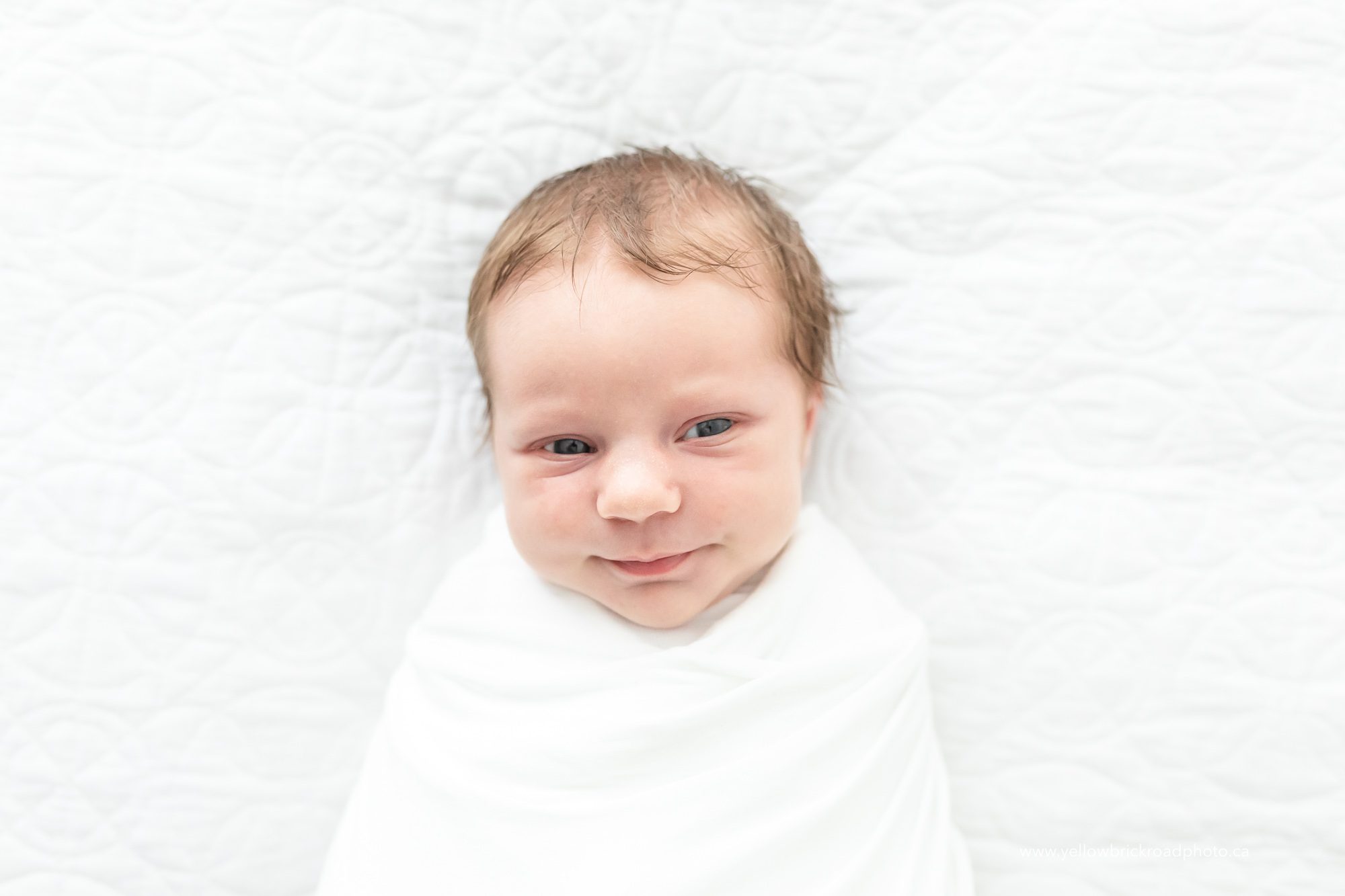 smiling newborn baby